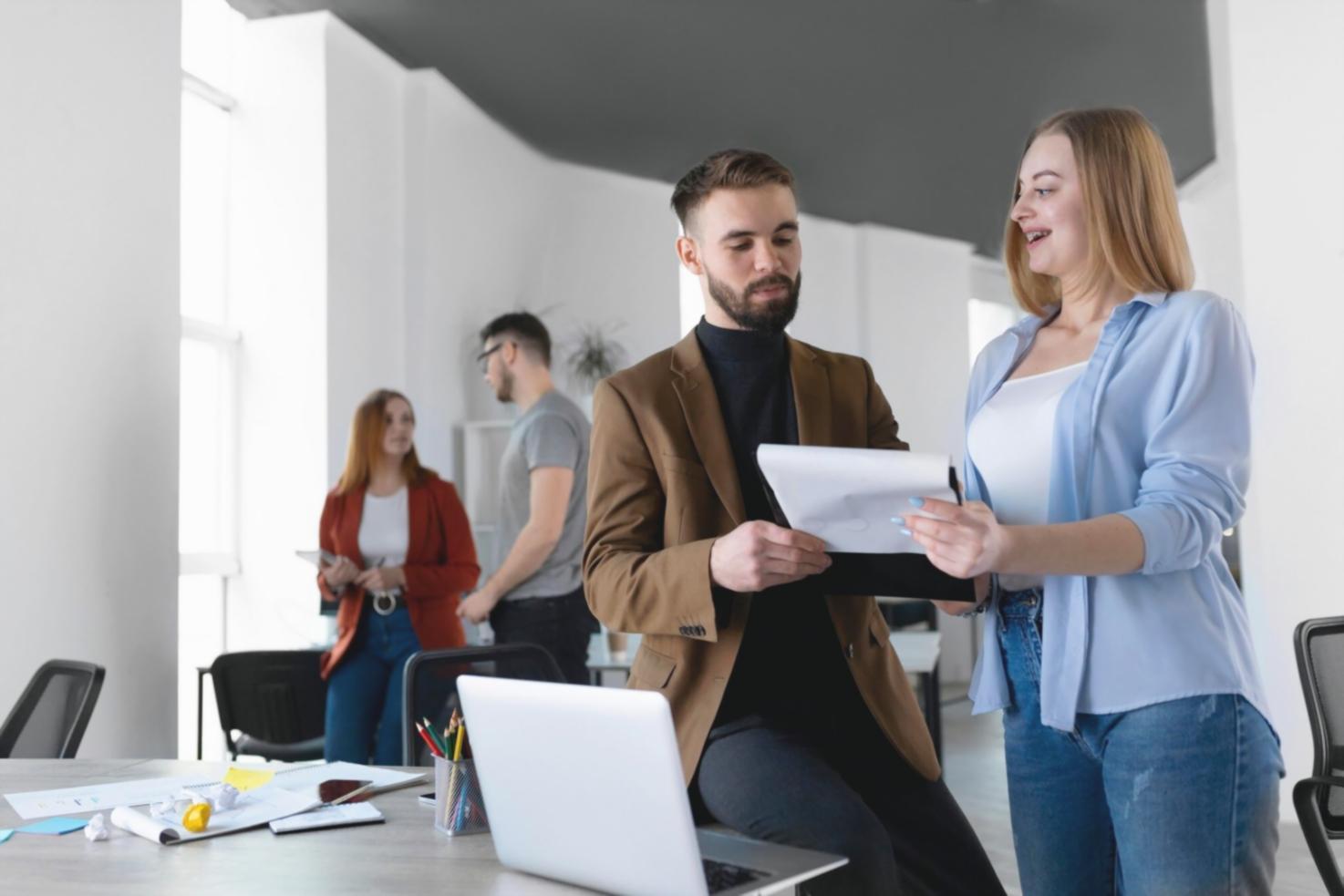 Financial analysis workspace setup with multiple screens and research materials
